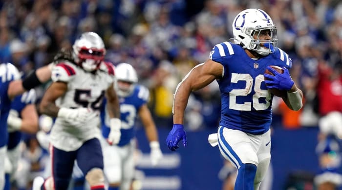 Colts running back Jonathan Taylor breaks away from the Patriots defense on his fourth-quarter touchdown run.
